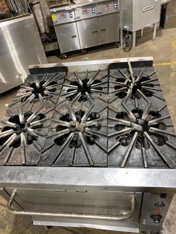 Montague Stainless Steel 6-Burner Gas Range and Convection Oven Combo on casters, used condition.