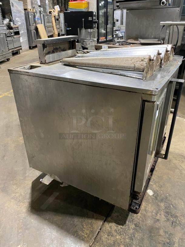 Blodgett stainless steel gas convection oven with solid-state thermostat, wired oven rack, and legs; shows signs of use.