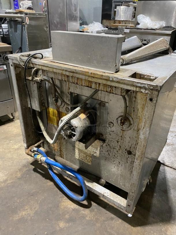 Blodgett stainless steel gas convection oven, single stack, thermostat, wired rack, legs; shows wear, industrial setting.