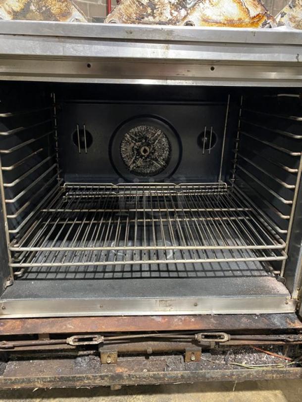 Blodgett commercial stainless steel gas convection oven with solid state thermostat, wired oven rack, and legs. Used condition.
