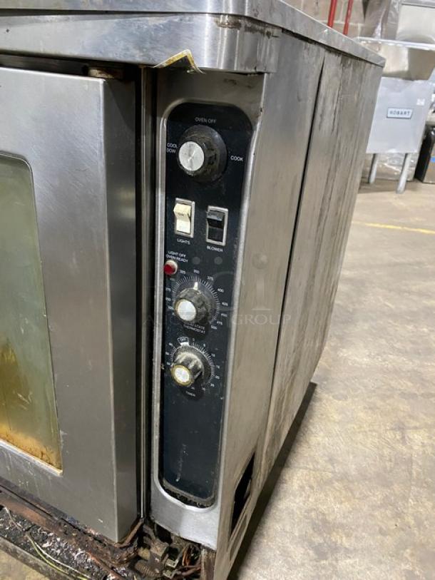Blodgett stainless steel gas convection oven, single stack, solid state thermostat, with wired rack and legs. Used condition.