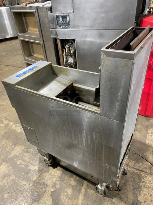 Pitco SFSG14JS stainless steel 40 lb. deep fat fryer, natural gas, with backsplash, basket hanger, filtration system, on casters.