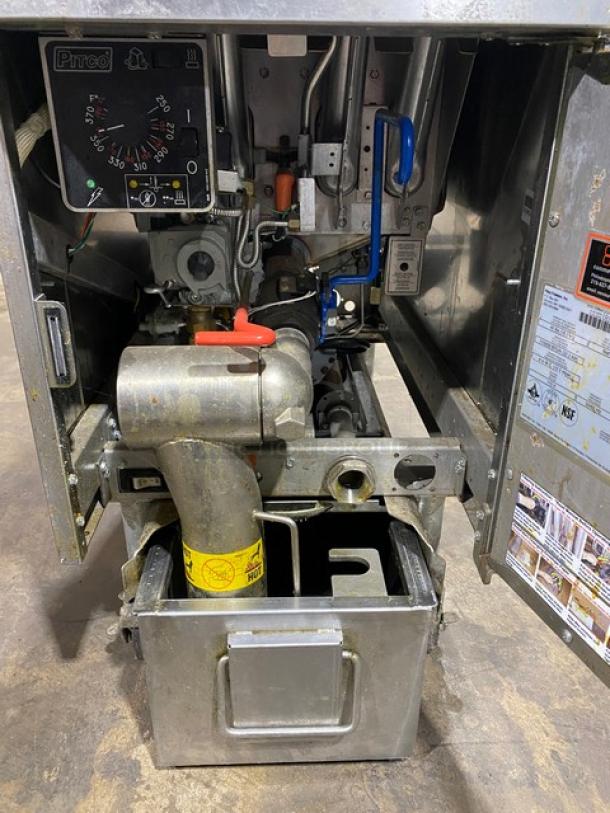 Pitco SFSG14JS commercial stainless steel deep fryer with filtration system and backsplash, visible internal components.