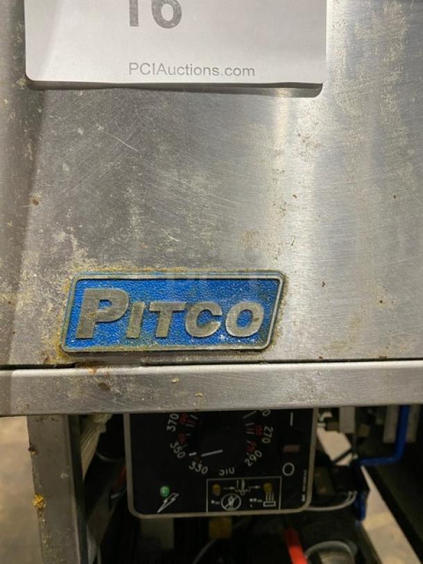 Pitco SFSG14JS stainless steel natural gas fryer, 40 lb. capacity, with filtration, backsplash, basket hanger, and casters.