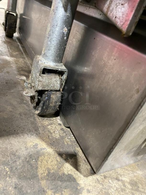 Pitco SFSG14JS commercial fryer caster, stainless steel base. Shows wear; sturdy construction. Ideal for restaurants.