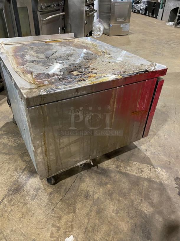 Turbo Air stainless steel 2-drawer refrigerated chef base on casters, showing signs of wear and surface staining.