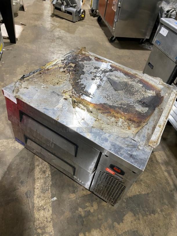 Turbo Air stainless steel 2-drawer refrigerated chef base on casters, visible wear and rust on top, model tag attached.