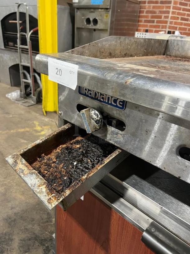 Radiance stainless steel gas countertop flat griddle, model TAMG-36, with back and side splash. Shows moderate use.