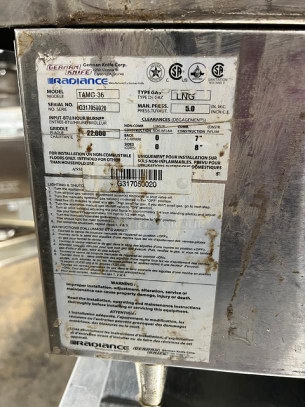 Radiance TAMG36 stainless steel gas griddle, with back and side splash. Serial: G317050020. Used condition, visible wear.