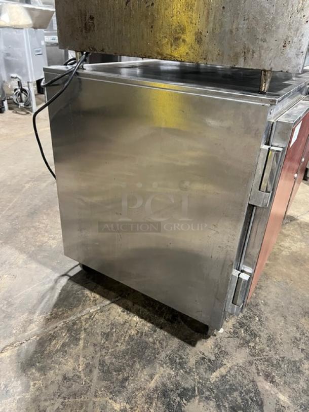 Beverage-Air UCR48A stainless steel 2-door undercounter refrigerator on casters, with poly-coated wired rack.