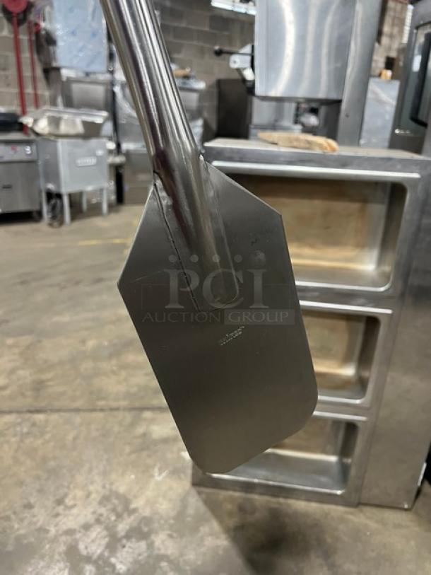 Winco Commercial Stainless Steel 48" Mixing Paddle, Model MPD-48. Durable with a sleek finish, ideal for large-scale mixing.
