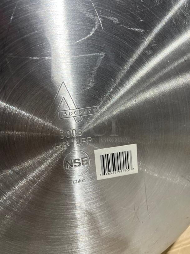 Adcraft H3-14FP aluminum frying pan, riveted iron handle, embossed model mark, "NSF" label visible, made in China.