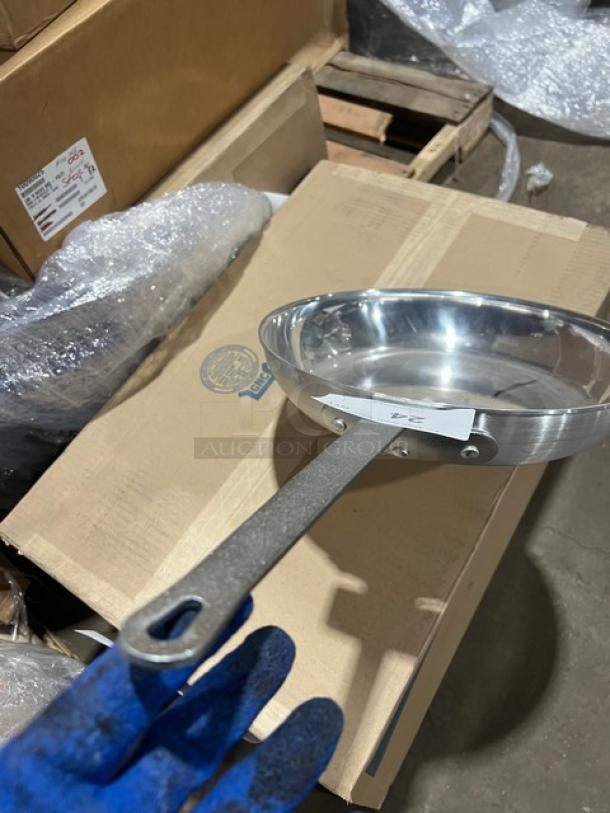 Adcraft H3-14FP aluminum frying pan with riveted plated iron handle, shown on a cardboard box, in excellent condition.