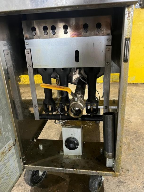 Asber AEF4050SENG stainless steel natural gas deep fryer with backsplash, 40/50 lb. capacity, on casters, used condition.