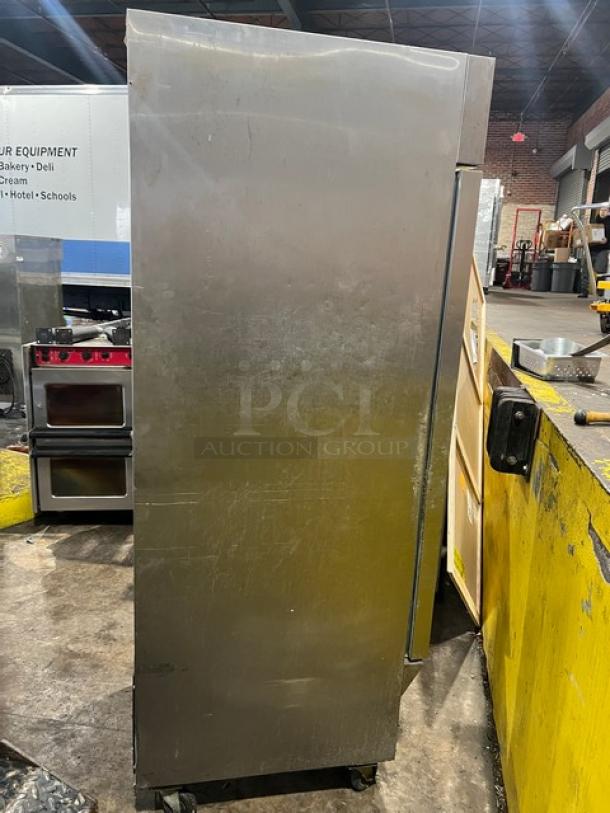 Arctic Air AF23 stainless steel single door reach-in freezer, poly coated wire rack, on casters, commercial use.