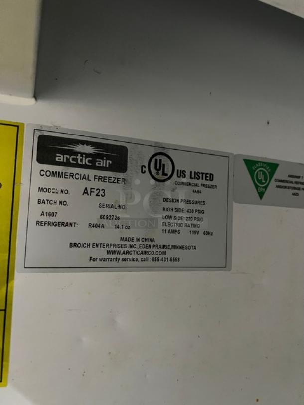 Arctic Air AF23 commercial stainless steel freezer, single door, 115V, with poly-coated rack, on casters. Serial: 6092726.