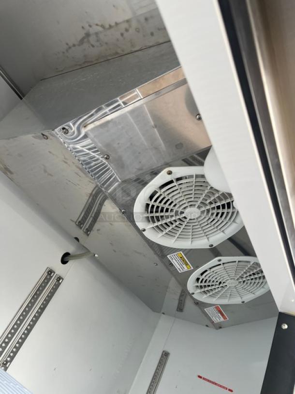 Beverage-Air KF48-1AS commercial stainless steel reach-in freezer interior with poly coated wire rack and cooling fans. Energy Star certified. 