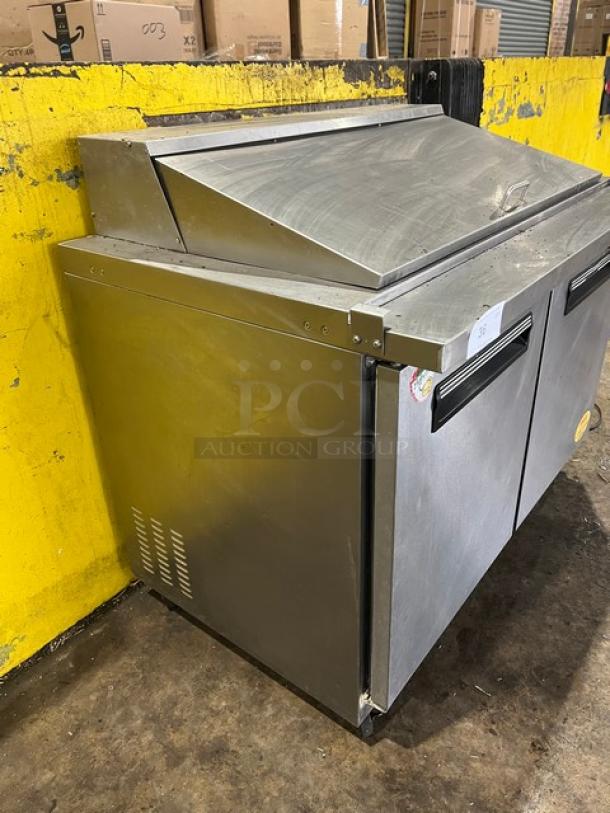 Maxx Cold stainless steel 2-door refrigerated bain marie prep table, model MXCR48MHC, with poly coated rack, on casters.
