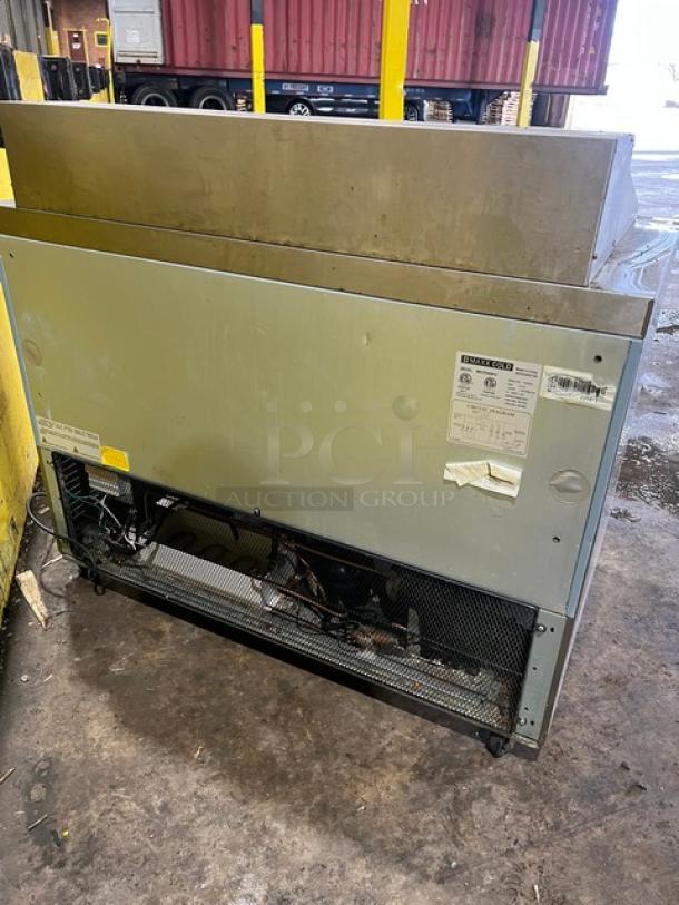 Maxx Cold MXCR48MHC stainless steel refrigerated prep table, with wired rack, label showing model and serial number, on casters.