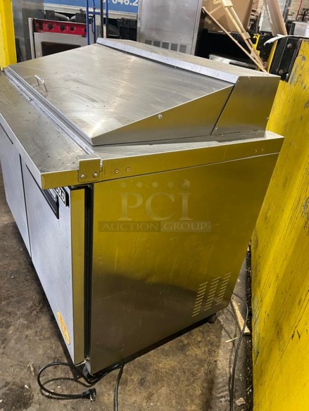 Maxx Cold stainless steel 2-door refrigerated prep table, model MXCR48MHC, on casters, with poly-coated wire rack.