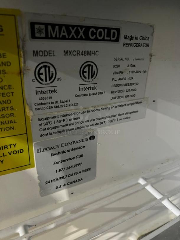 Maxx Cold MXCR48MHC stainless steel 2-door refrigerated prep table with poly-coated rack and casters, ETL certified.