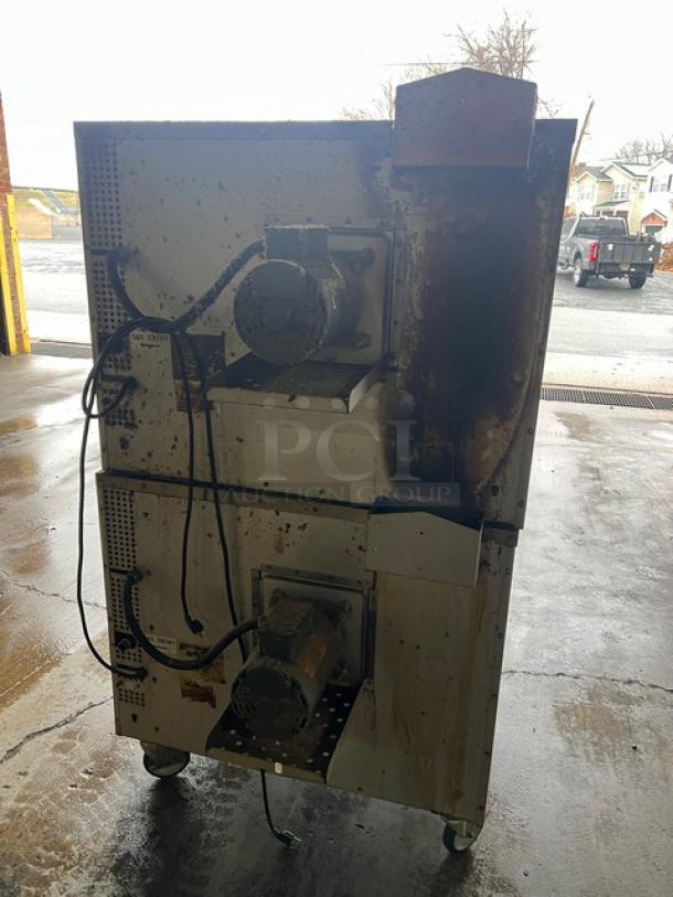 Patriot FMCOF54NG double stacked convection oven, stainless steel, natural gas, thermostatic controls, on casters, visible wear.