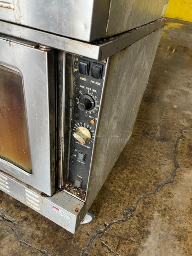 Patriot FMCOF54NG stainless steel double stacked convection oven, natural gas, thermostatic controls, on casters, wear visible.