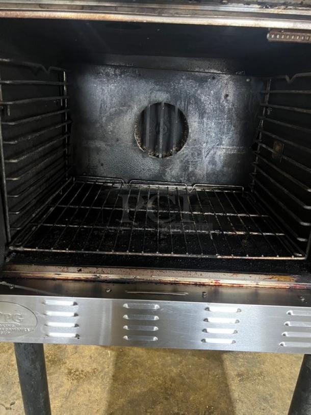 CPG stainless steel gas convection oven, single stack, thermostatic controls, wired oven rack, mounted on legs.