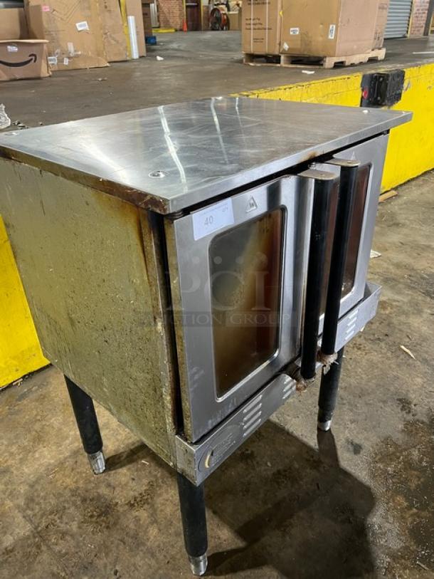 Cpg commercial stainless steel gas convection oven with thermostatic controls, wired rack, single stack, on legs, used condition.