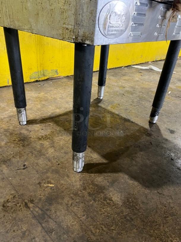 Cpg commercial stainless steel gas convection oven on sturdy legs, featuring thermostatic controls and a wired oven rack.