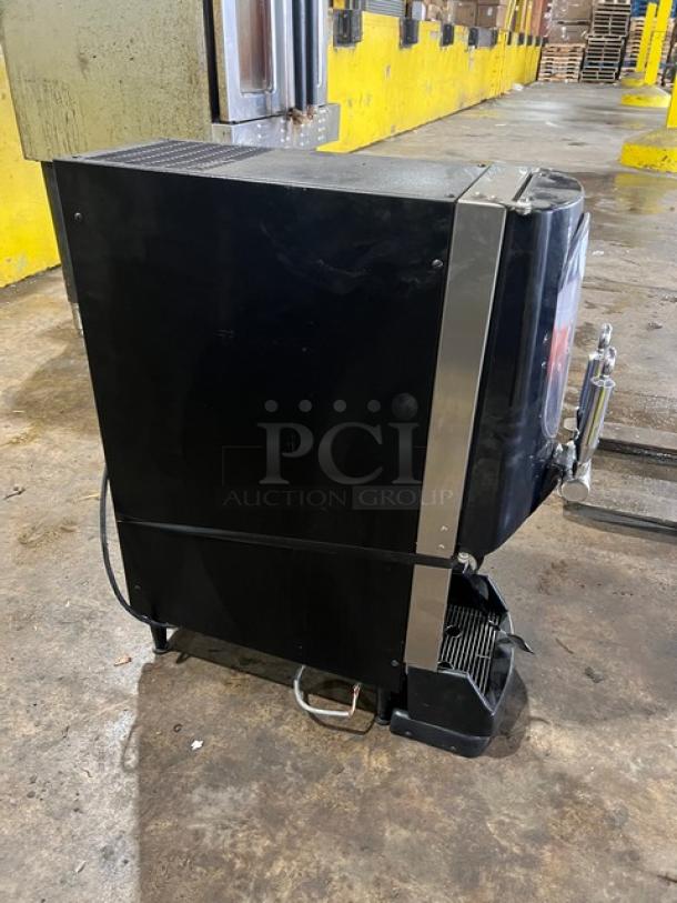 Bunn Nitron Cold Draft Coffee Dispenser, Model NITRONCTBASE, with dual nitro and cold brew chrome dispensers, black, on legs.