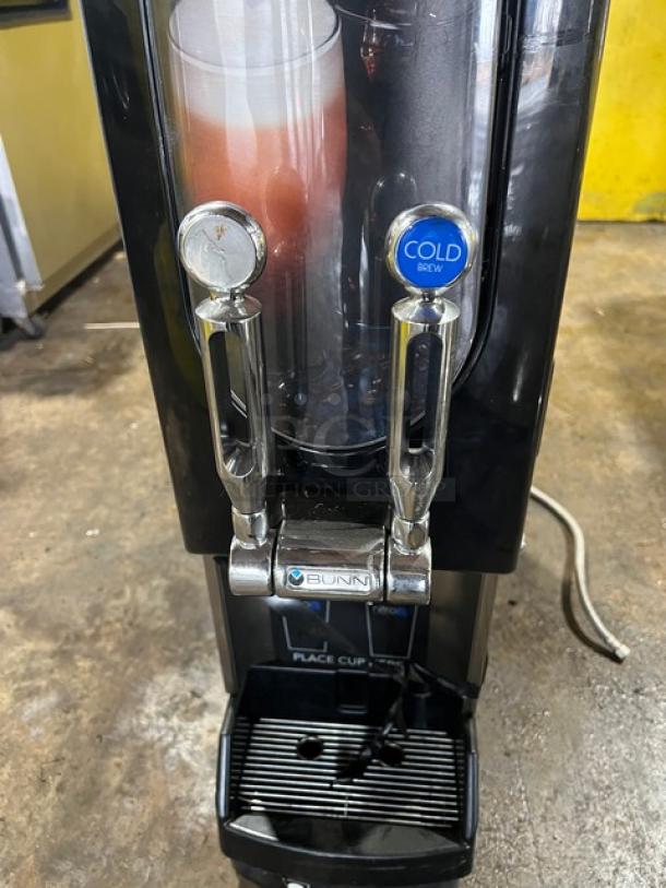 Bunn Nitron CT-BASE countertop cold brew coffee dispenser, dual chrome dispensers, black, with visible branded labels, 120V.