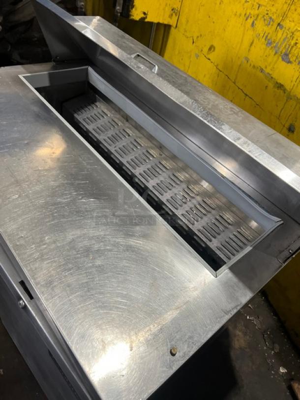 Continental stainless steel 2-door refrigerated prep table for salad/sandwiches, bain marie style, 115V, on legs, visible lid.