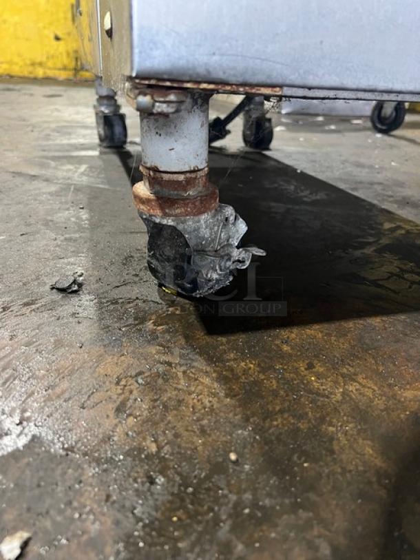 Electro Freeze 78RMT232 soft serve machine on casters, featuring a stainless steel body. Visible wear on wheels.