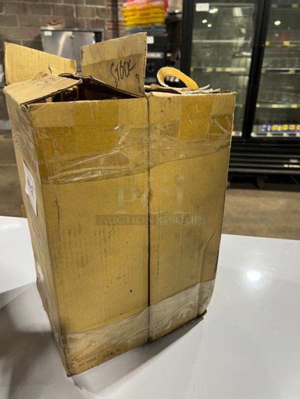 Cardboard box with Connoisseur Commercial Mesh Round Pasta Basket inside, featuring a coated yellow grip handle. New condition.