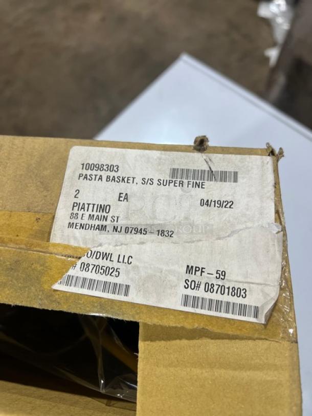 Connoisseur Commercial Mesh Round Pasta Basket with coated yellow grip handle, new in box, label shows product details and codes.