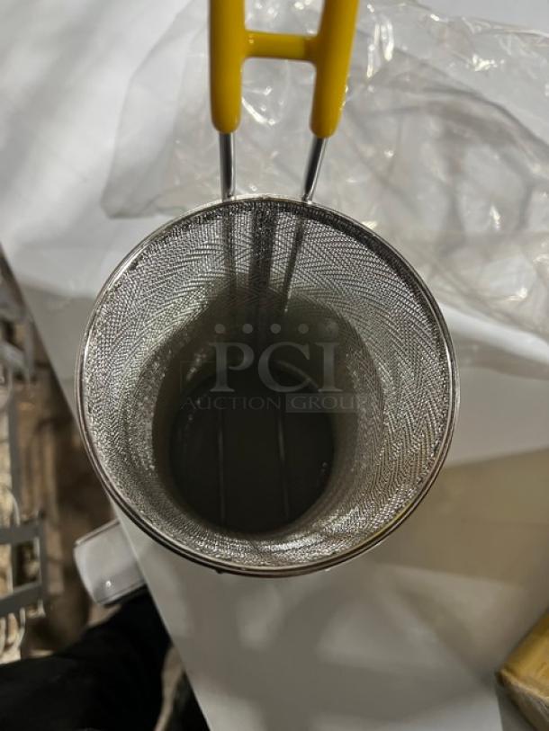 NEW Connoisseur mesh round pasta basket with coated yellow grip handle, commercial-grade, pristine condition.