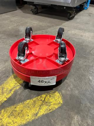 New commercial red round multi-purpose dolly, featuring four swivel casters. Label indicates auction lot number 46.