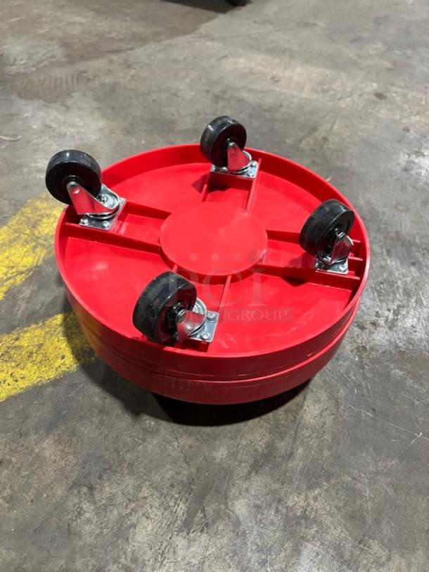 New commercial red round multi-purpose dolly with four swivel casters, in excellent condition.
