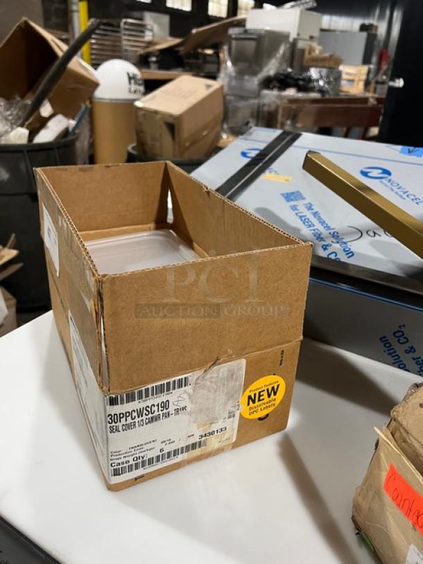 New Cambro Commercial Translucent 1/3-Size Pan Seal Cover, Model 30PPCWSC190, in box with label indicating new condition.