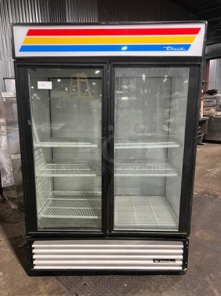 True Commercial GDM-49RL double glass swing door refrigerator, featuring poly-coated wire racks, in used condition. 