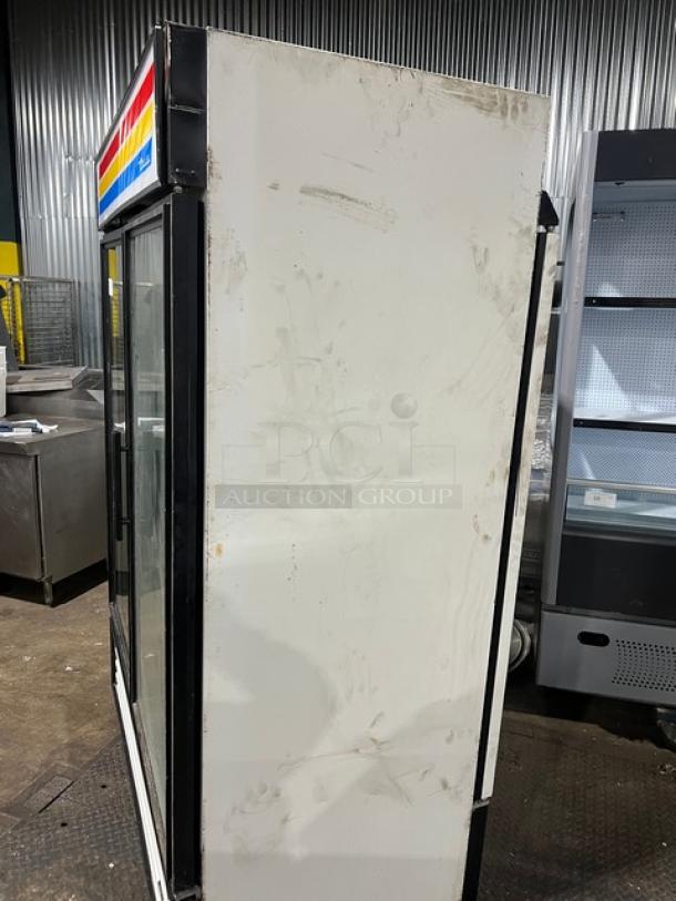 True Commercial Double Glass Door Merchandiser Refrigerator, Model GDM-49RL, black and white finish, poly-coated wired rack, used condition.