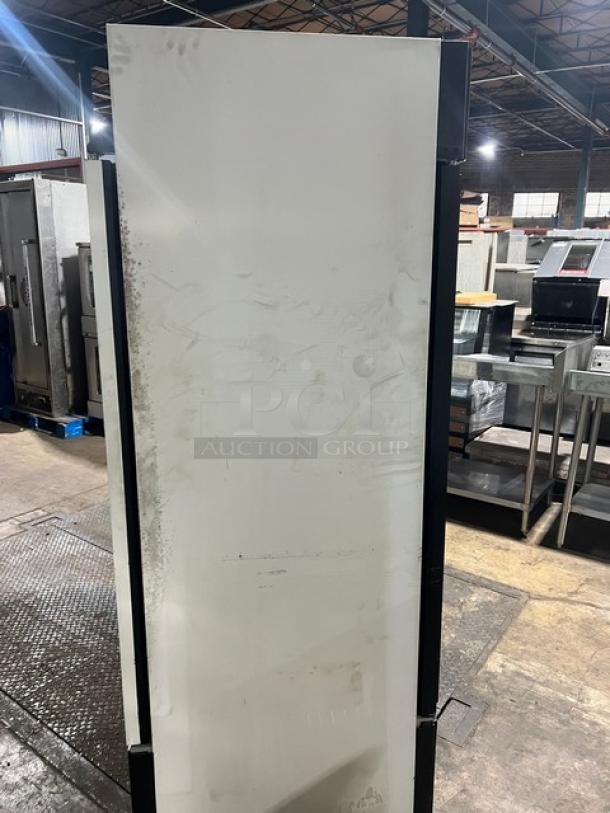 True GDM49RL double glass swing door merchandiser refrigerator, black and white, poly-coated wire rack, commercial use.