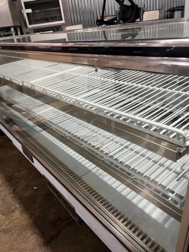 Leader Stainless Steel 2-Tier Bakery Display Case, Model NCBK77, features rear glass sliding doors and poly-coated wire racks.