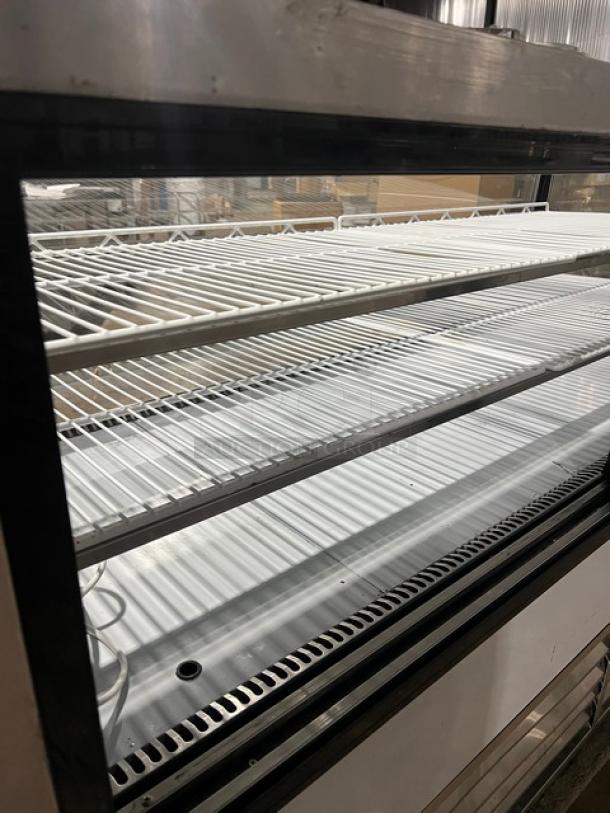 Leader NCBK77 stainless steel bakery merchandiser display case, two-tier, straight glass, rear sliding doors, poly-coated racks, 115V.