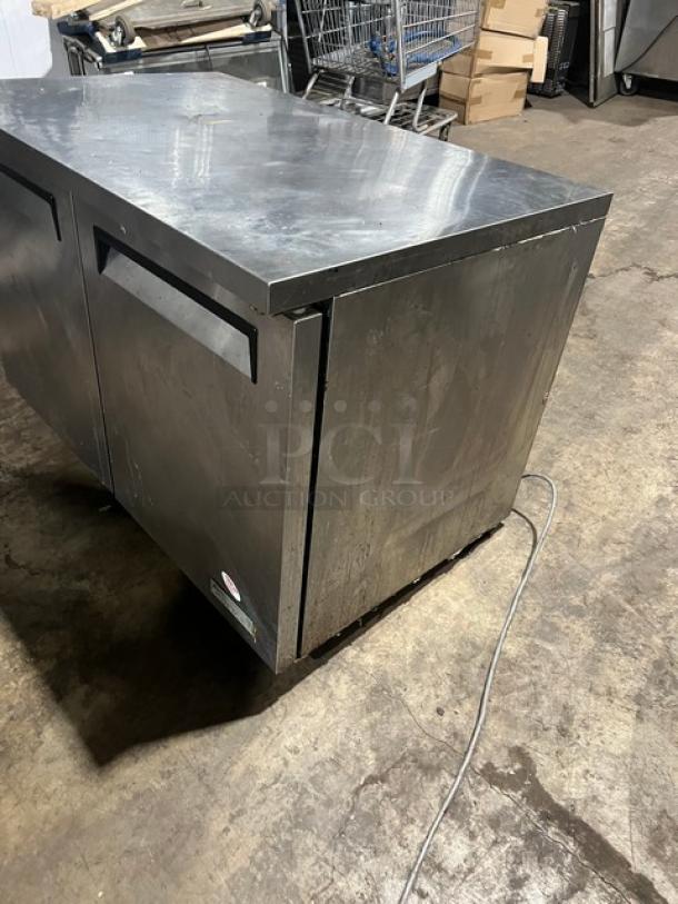 Green World GUC-48DR stainless steel 2-door undercounter refrigerator on casters, with poly coated wired rack, in used condition.