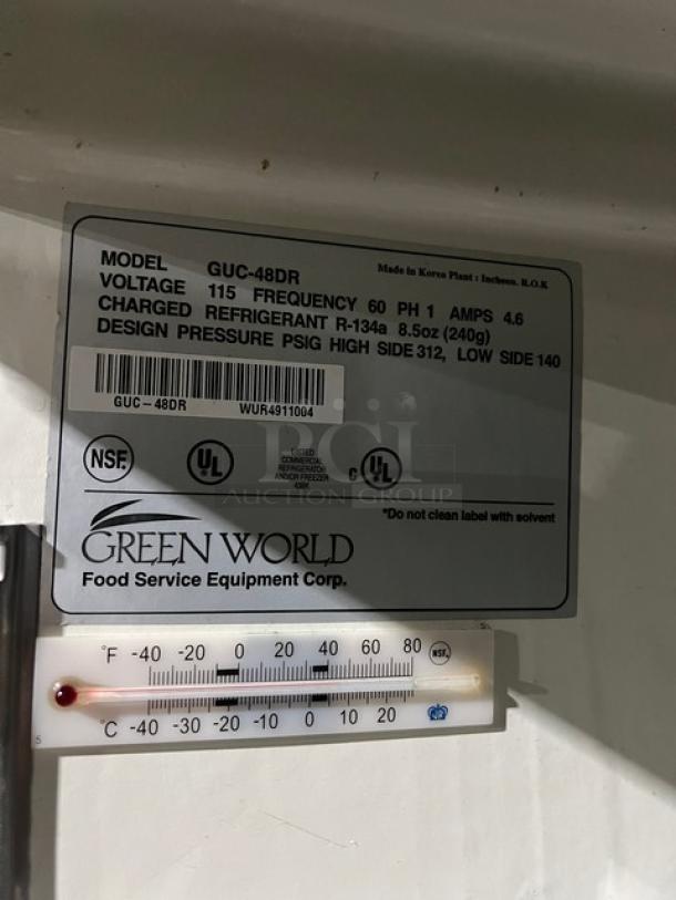 Green World GUC-48DR stainless steel 2-door undercounter refrigerator, model details label, 115V, on casters.