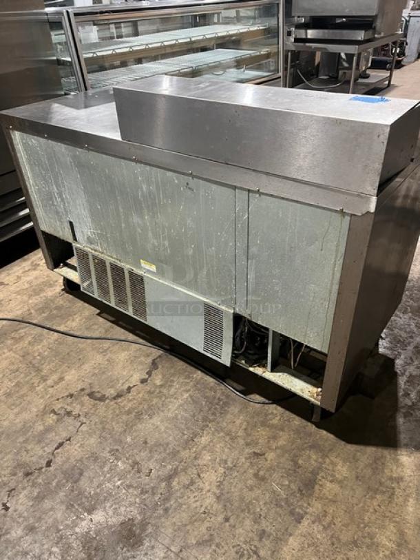 Beverage-Air Stainless Steel 2-Door Refrigerated Prep Table Model SPE60-08, with poly-coated wired rack, on casters.