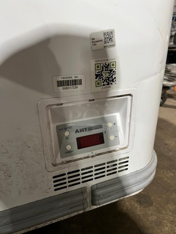 AHT MALTA185 commercial chest freezer, double sliding doors, visible control panel. Labels indicate model and serial numbers.