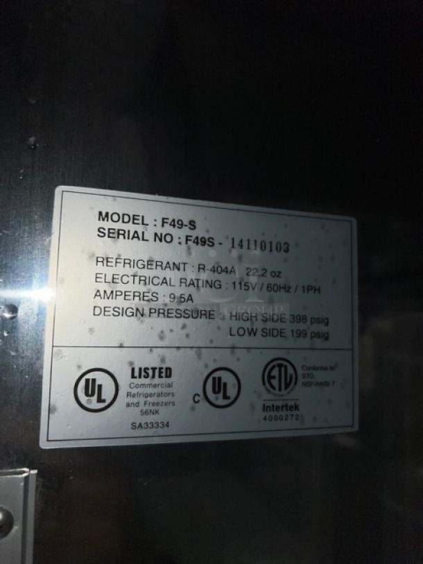Master Bilt Fusion Series stainless steel 2-door reach-in freezer, model F49S, serial 14110103, with poly-coated racks and commercial casters. UL, ETL listed.
